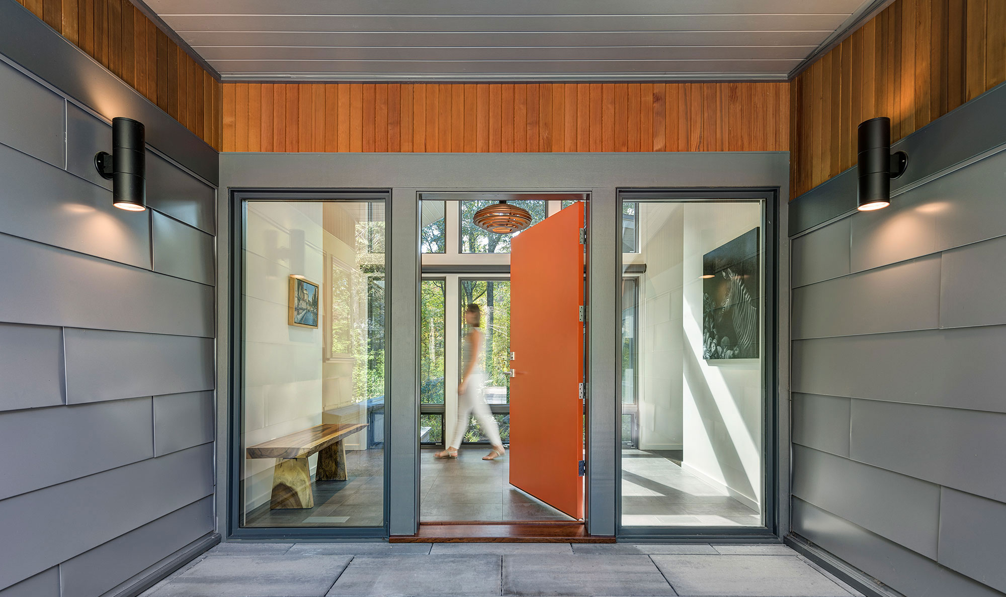 orange front door covered entryway