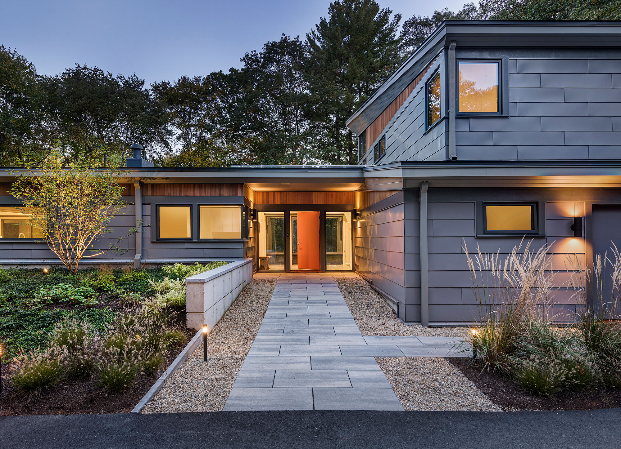 exterior home front entry with grey metal siding