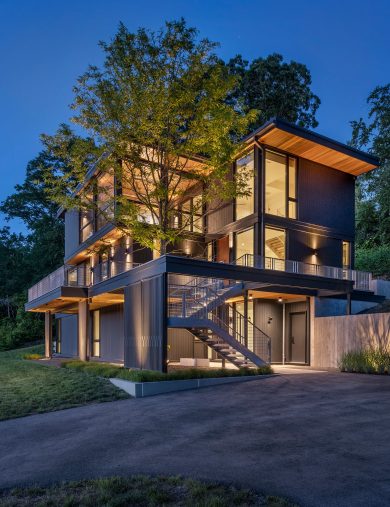 photo of exterior of annisquam river house at dusk