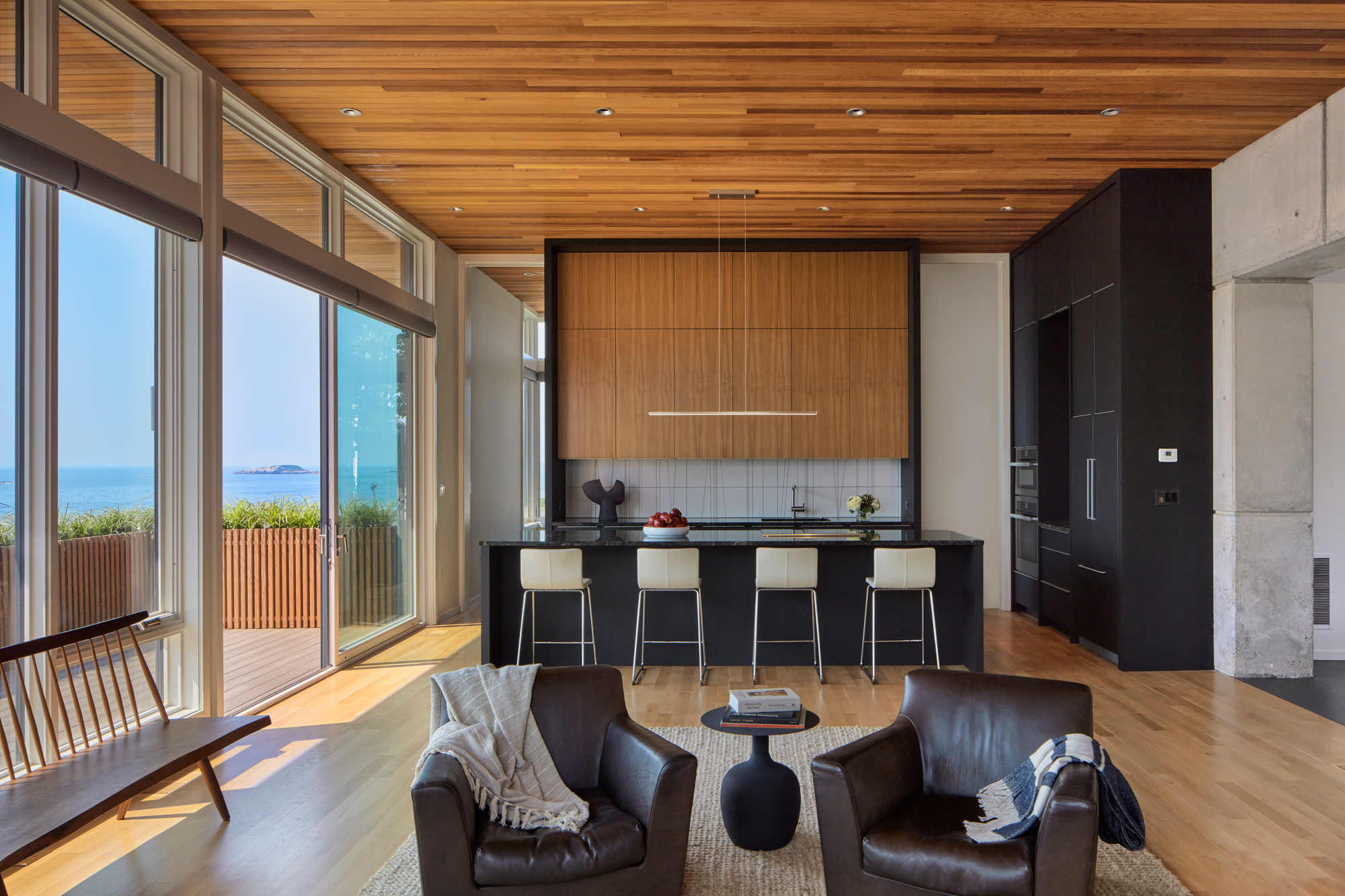 great room with kitchen and deck
