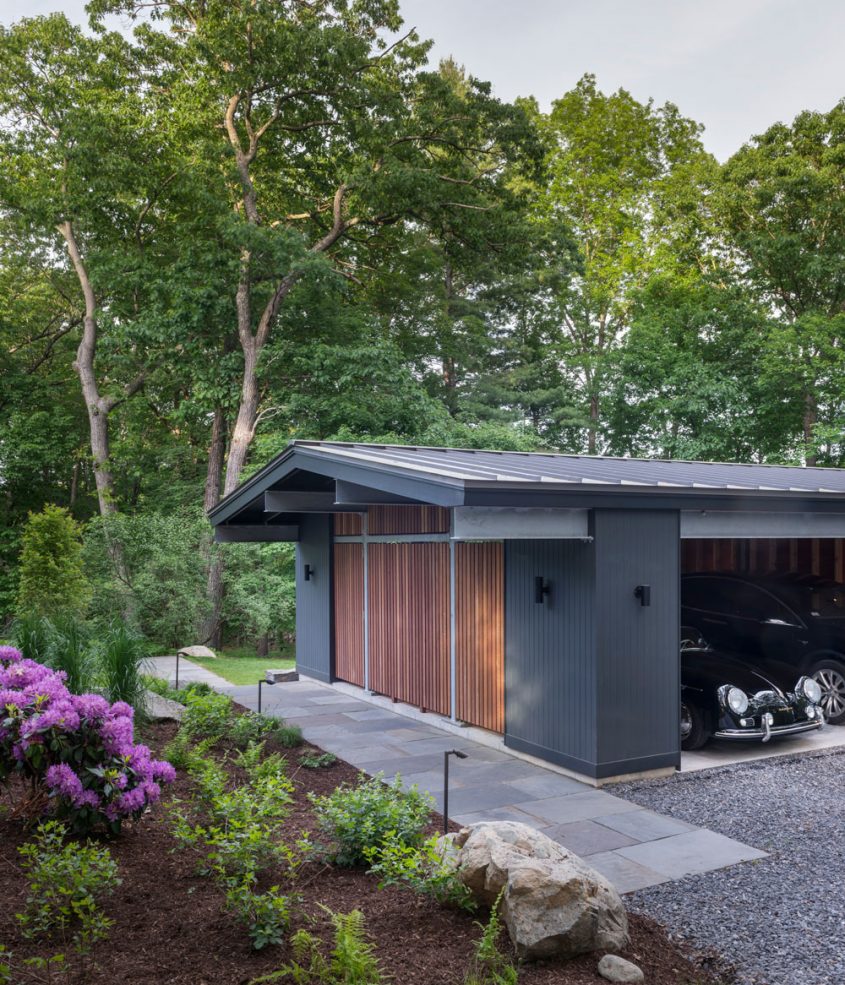 front elevation of carport with porsche