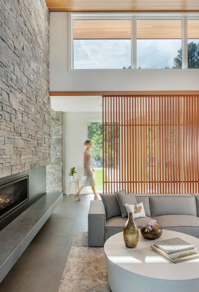 living room looking toward front entry behind screen