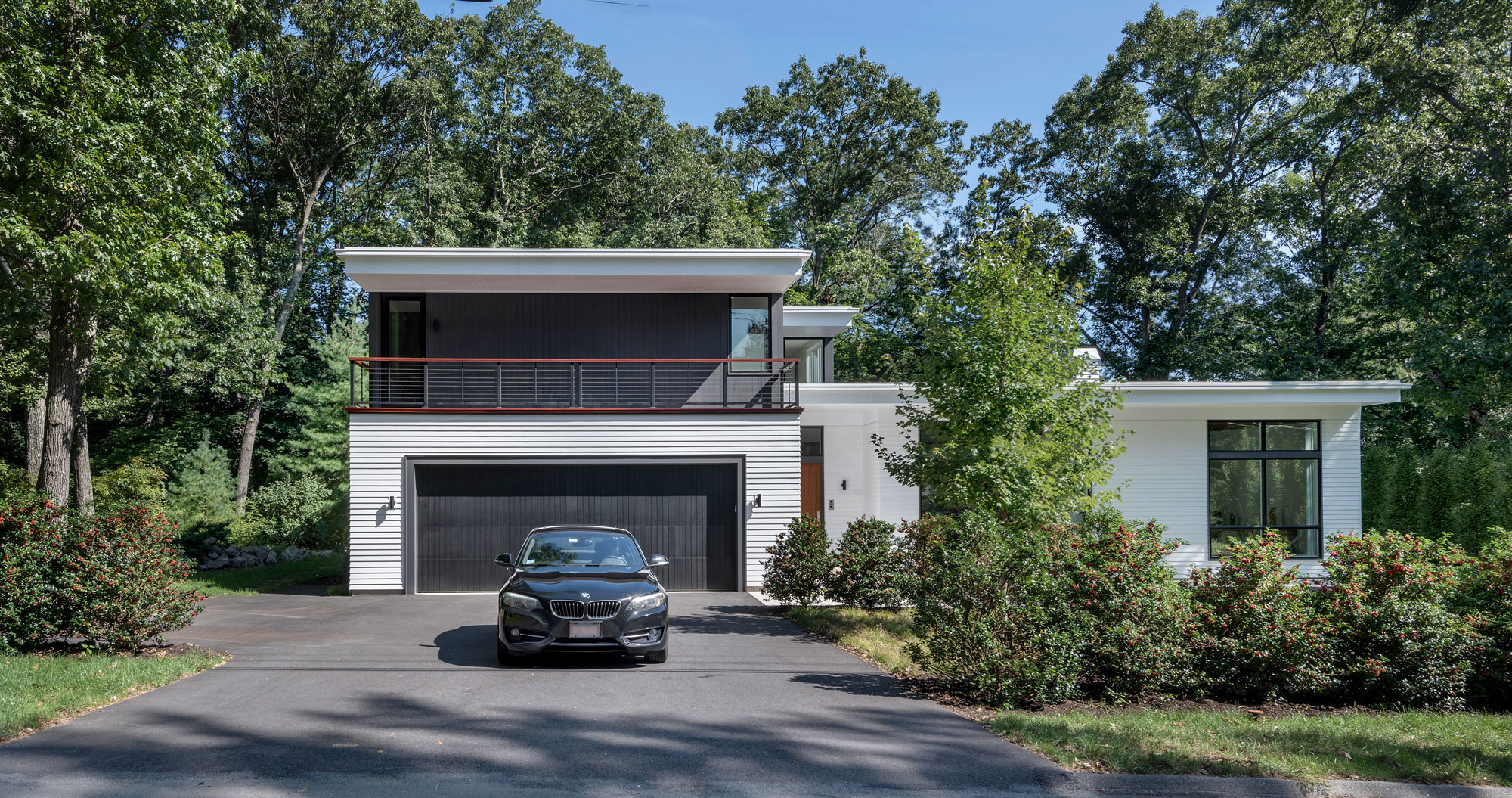 driveway entry with balcony on second floor