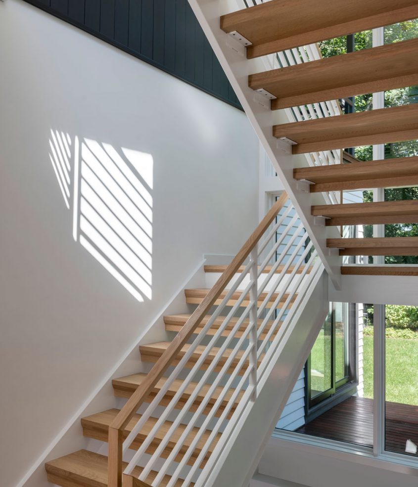 modern white staircase with natural wood