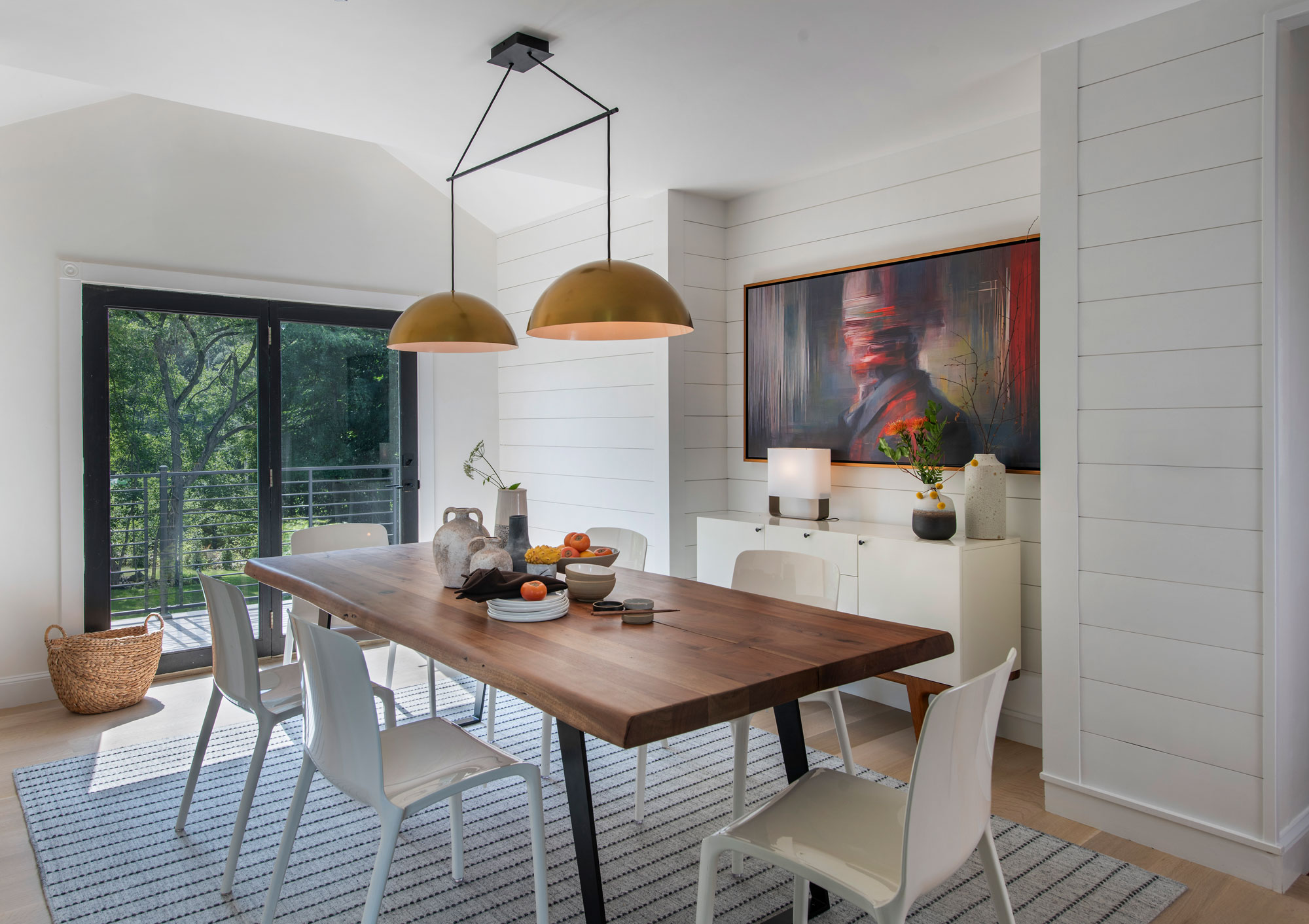 Dining room with natural lighting and a white furniture theme to match interior.