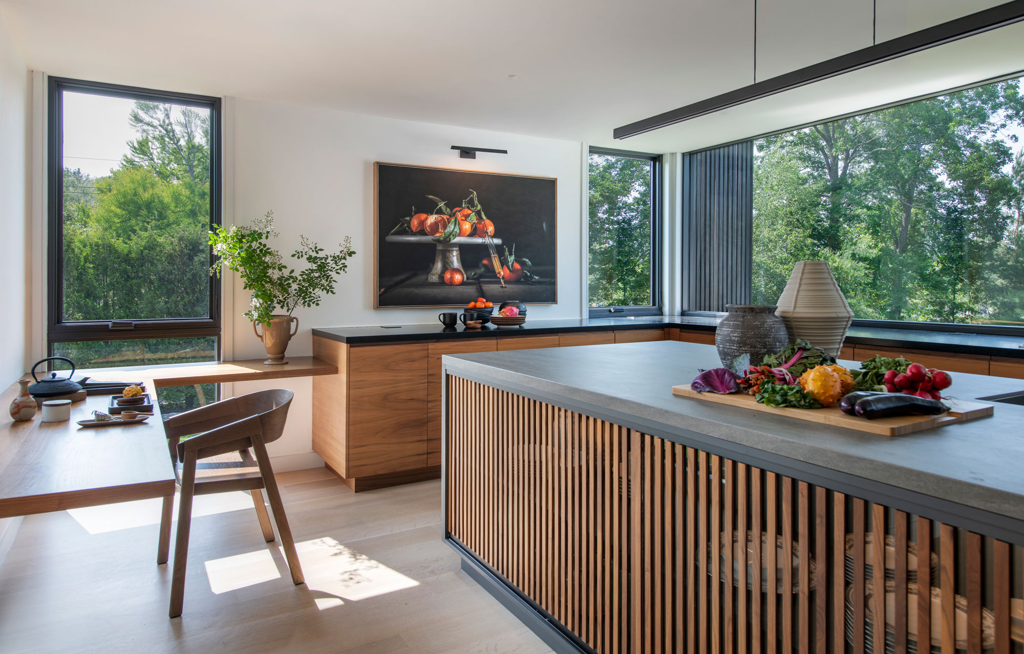 Kitchen photo with natural lighting and contemporary wood detailed interior.